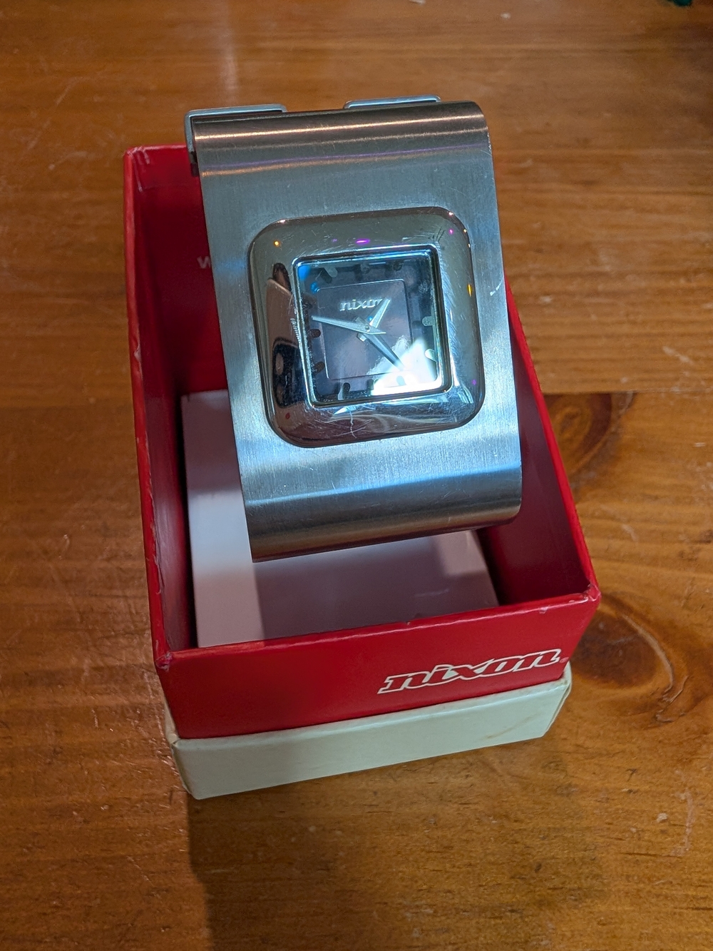 Nixon The Clique Silver Stainless Steel Cuff Watch with Black Dial